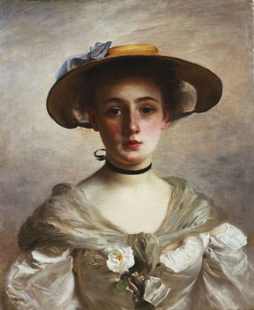 Ritratto di una giovane ragazza con un cappello di paglia